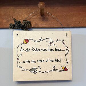 An old fisherman lives here with the catch of his life! Wall Deco Wooden Sign